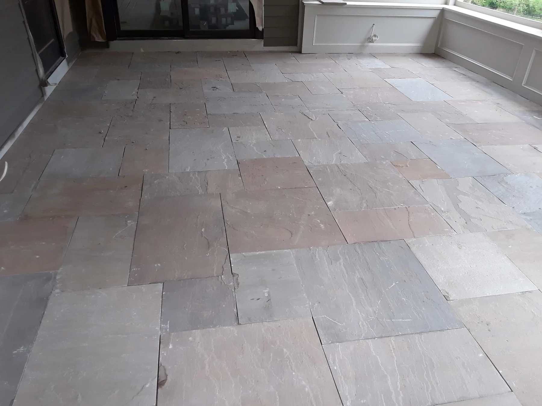 Large stone tiles on a covered patio