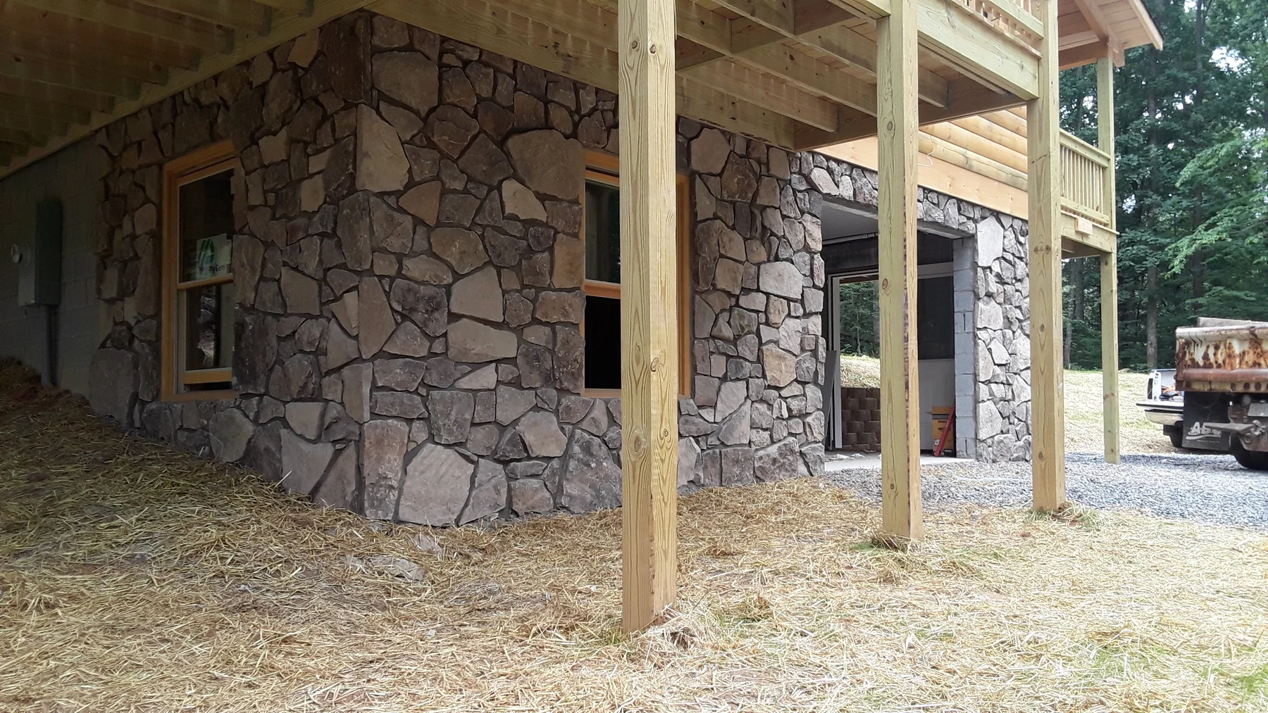 Natural stone exterior beneath a deck