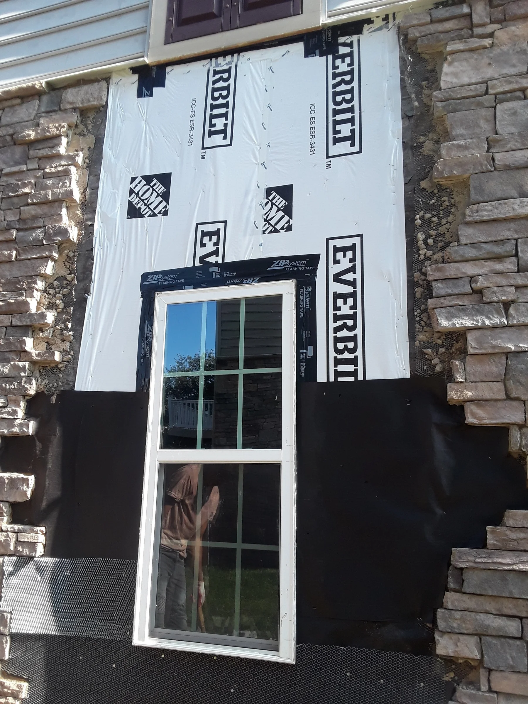 Exterior masonry repair around a window