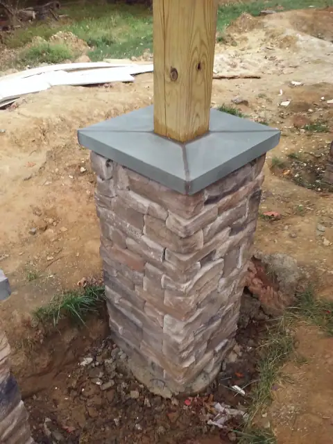 Stone column installation in progress at a covered structure