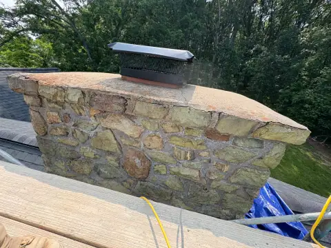 Chimney construction or repair in progress by F. Stone Designs