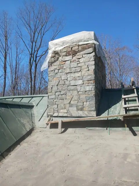 Chimney construction or repair in progress by F. Stone Designs