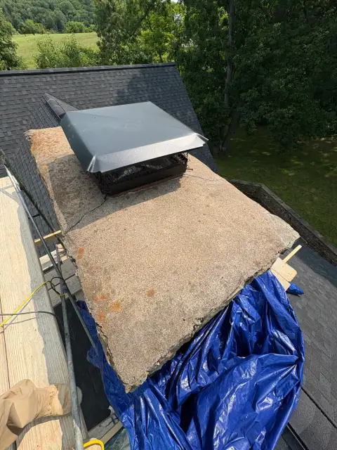 Chimney cap masonry repair in progress