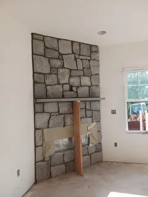 Indoor stone fireplace opening before final installation