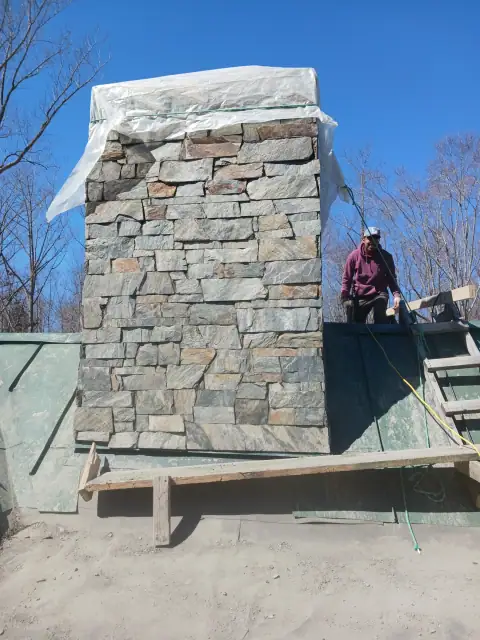 Chimney construction or repair in progress by F. Stone Designs