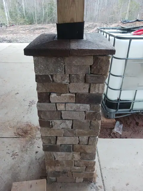 Completed freestanding stone column with cap
