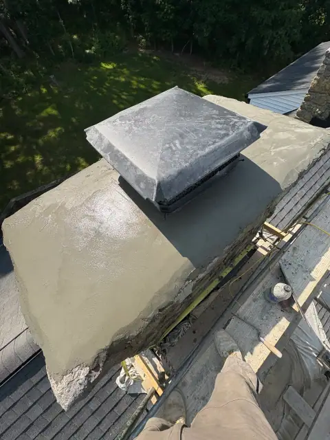 Chimney cap repair with fresh masonry work