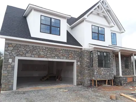 Stonework across a two-story house front