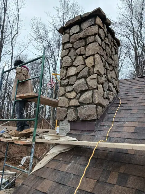Chimney construction or repair in progress by F. Stone Designs