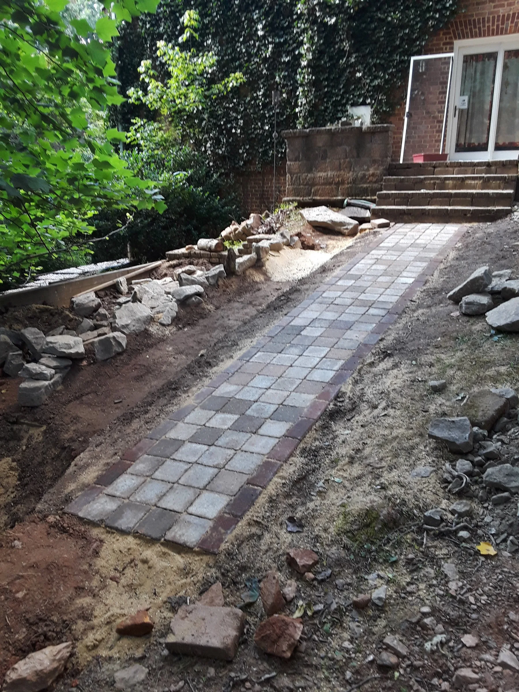 Paver path alongside a garden